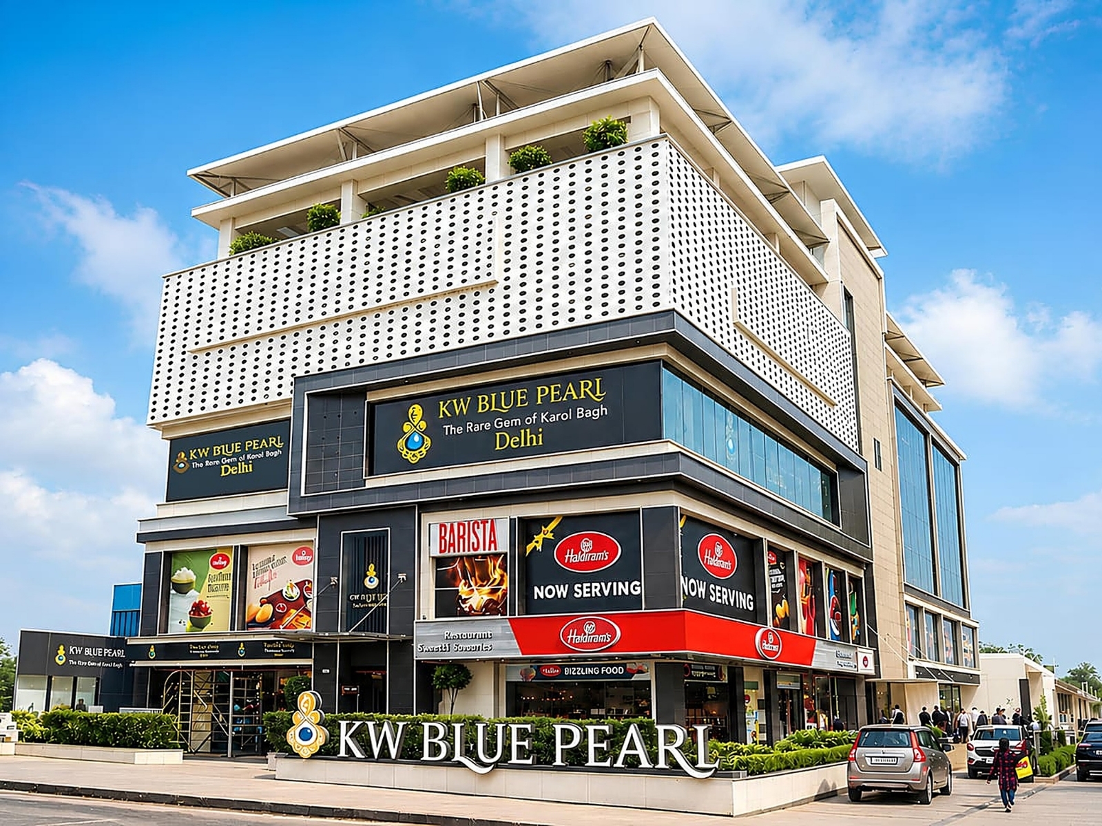 KW Blue Pearl — daylit corner glass facade on DB Gupta Road, Karol Bagh