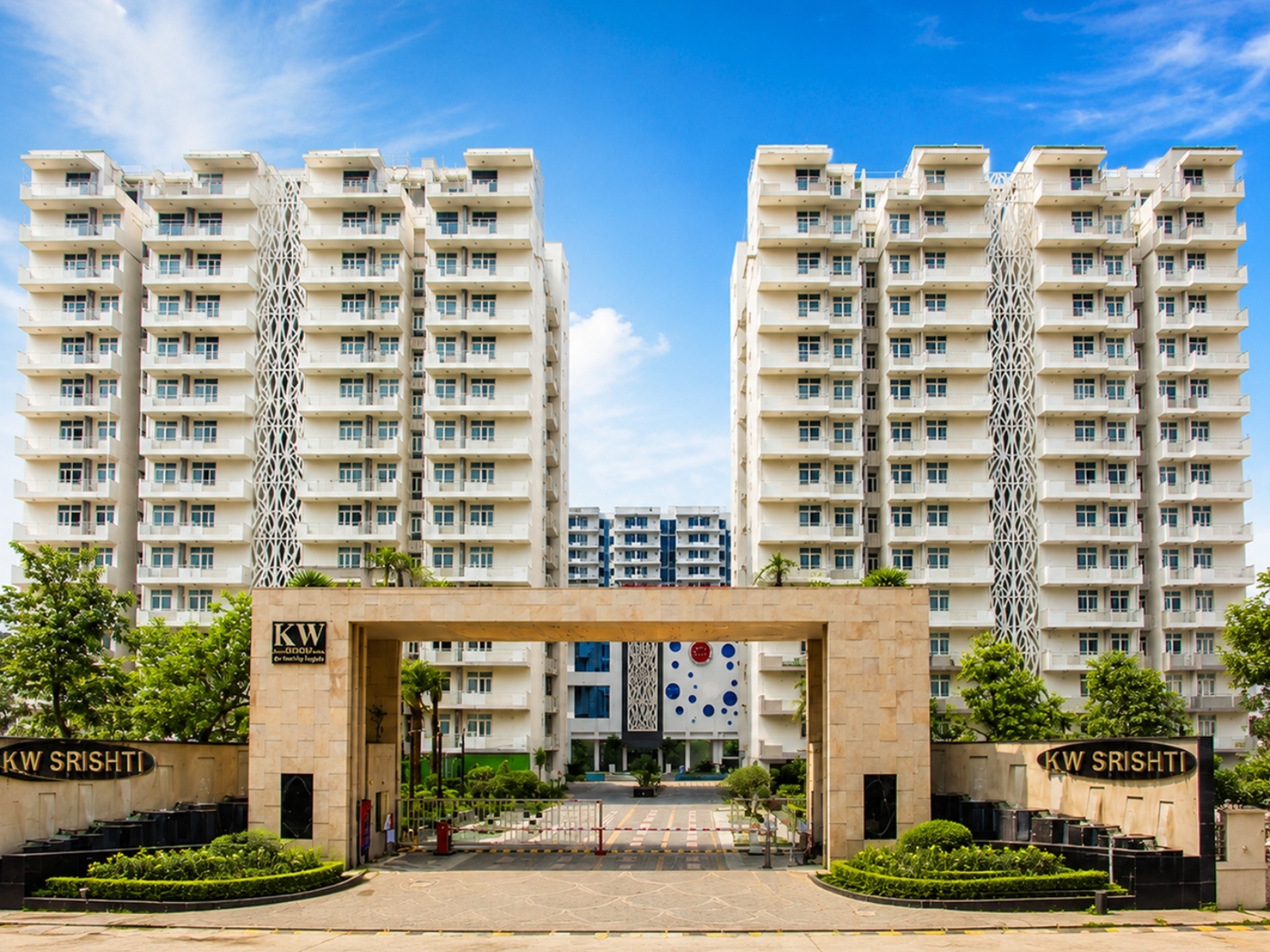KW Srishti — twin-tower gateway facade at the 10-acre Raj Nagar Extension township