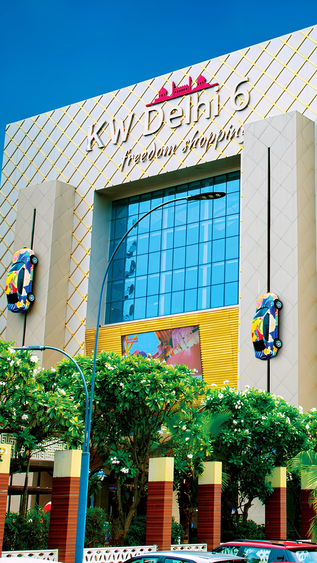 KW Delhi 6 funnel-shaped commercial complex with illuminated facade in Raj Nagar Extension