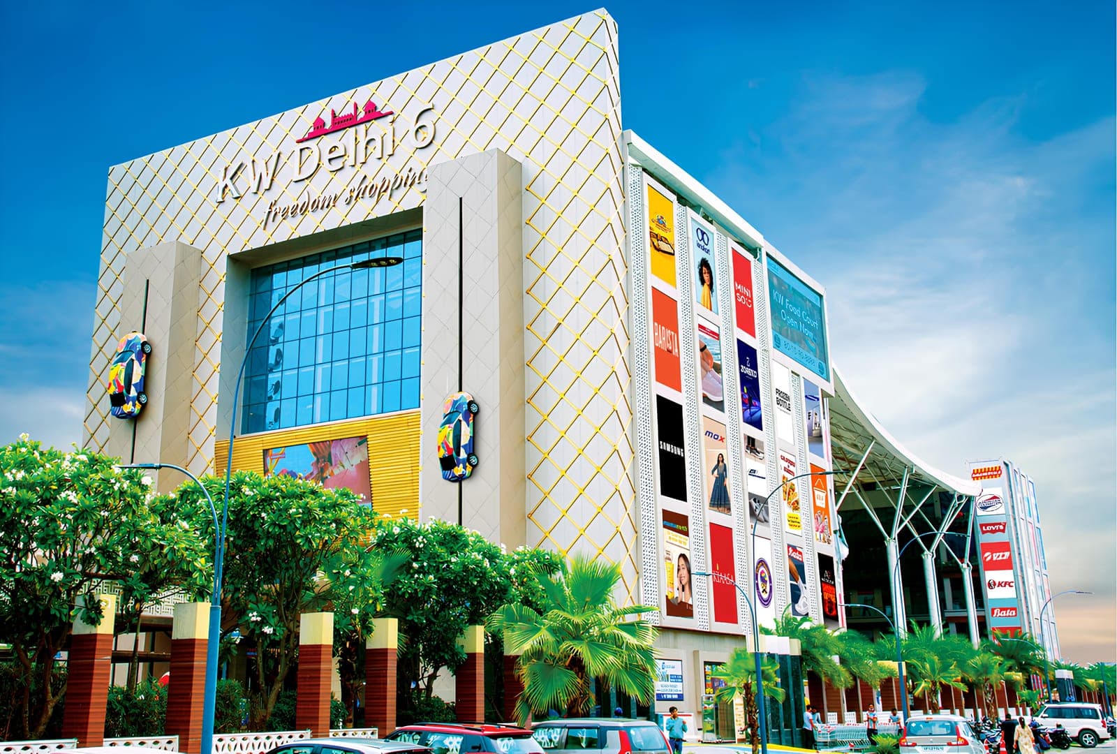 KW Delhi 6 funnel-shaped commercial complex with illuminated facade in Raj Nagar Extension